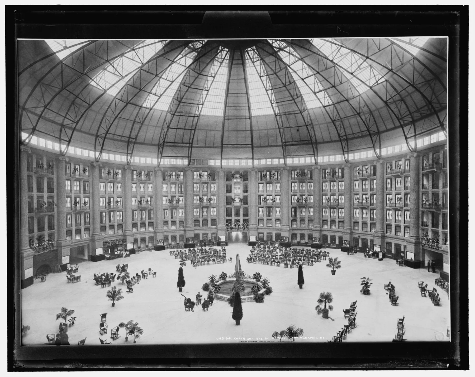 Archival black-and-white photograph of the vast West Baden atrium with guests on its floor